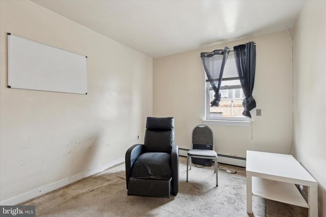 a bedroom with a bed and a sink