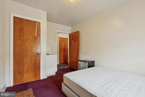 a view of kitchen filled with furniture and flat screen tv
