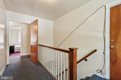 a kitchen with stainless steel appliances a sink cabinets and a window