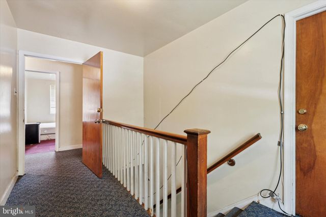 a kitchen with stainless steel appliances a sink cabinets and a window