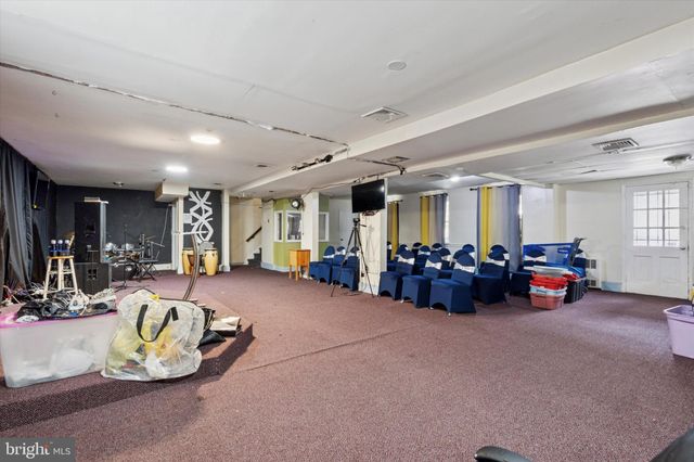 a living room with lots of furniture and lots of furniture