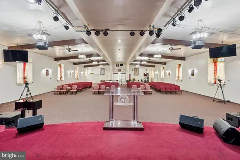 a room with lots of furniture and clutter