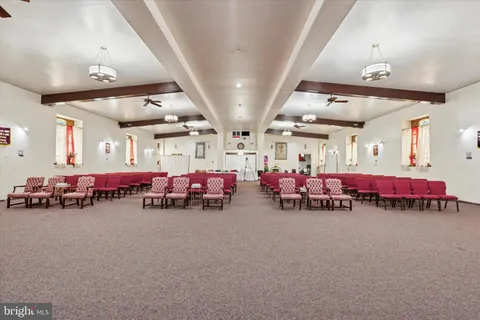 a room with furniture and pool table
