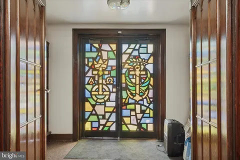 a kitchen with stove and cabinets