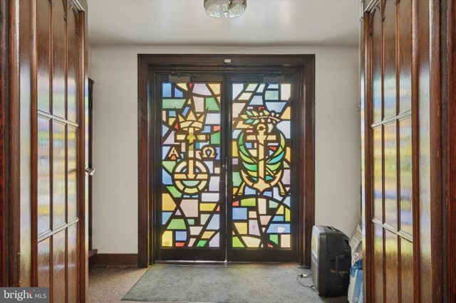 a kitchen with stove and cabinets