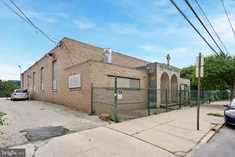 a view of a room with furniture and wooden floor