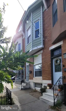 a view of a brick building with many windows