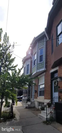 a group of cars parked in front of brick building