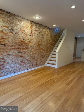 a view of a an empty room with stairs