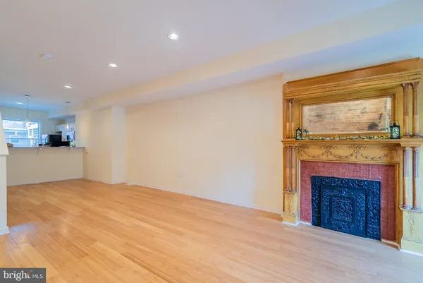 a view of an empty room with a fireplace