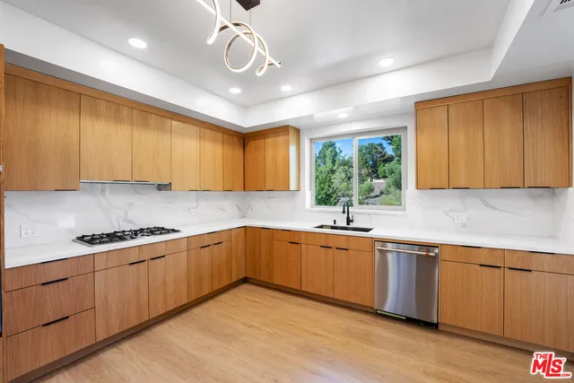 a kitchen with lots of counter space and a sink