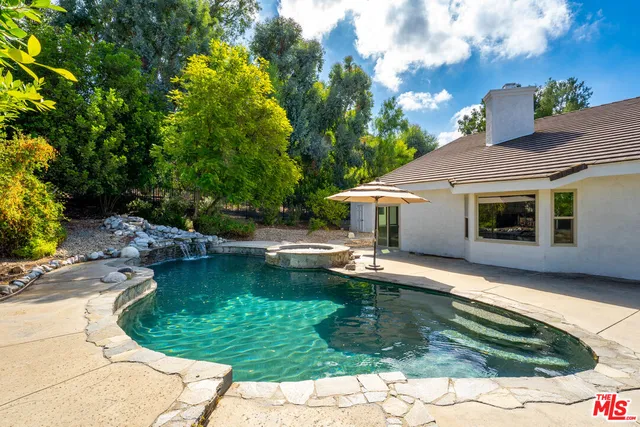 a view of a house with swimming pool