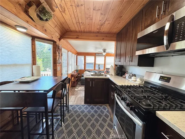 a bedroom with a bed and wooden furniture