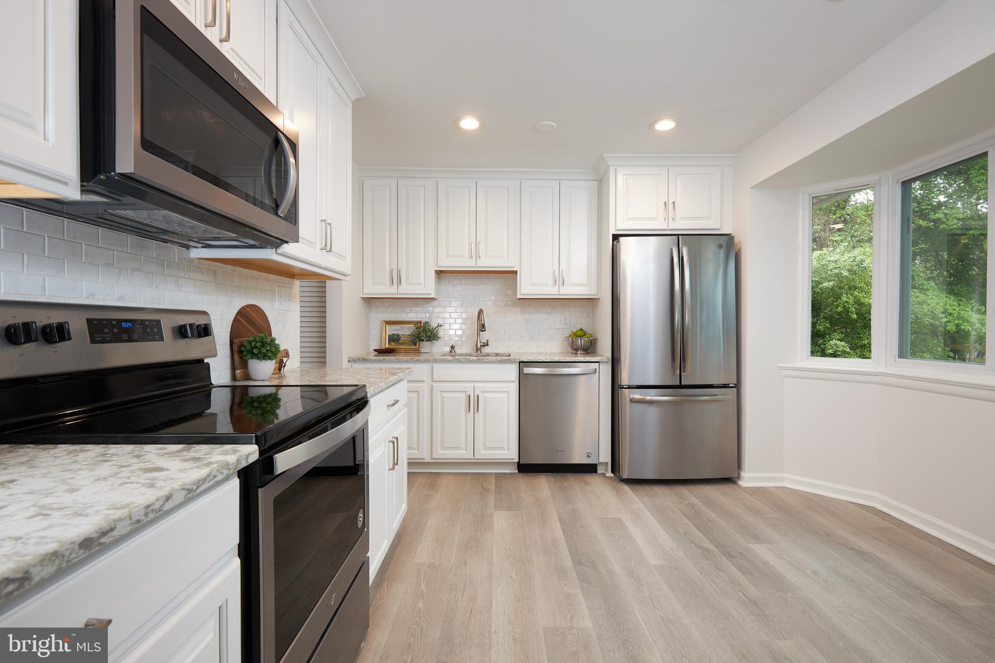 2408 Harmon Road Silver Spring, MD 20902 - Photo 13 of 38 Quartz + laminate = Elegance, with easy cleanup!