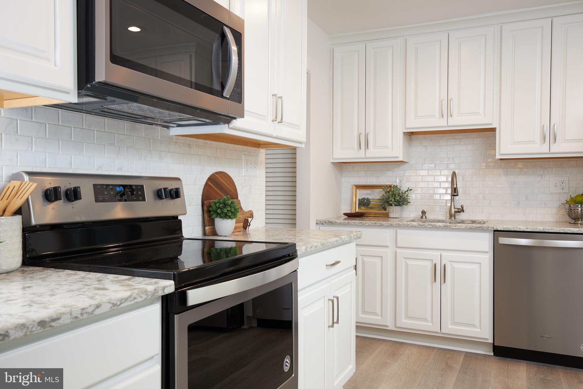 2408 Harmon Road Silver Spring, MD 20902 - Photo 14 of 38 New 42" cabinets & stainless steel appliances