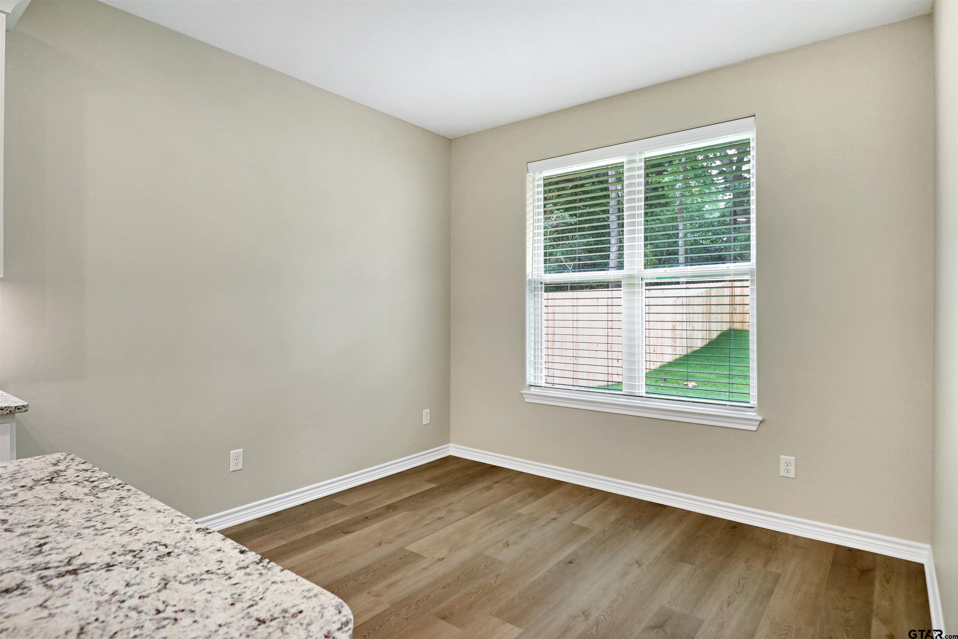 3053 Guinn Farms Road Tyler, TX 75707 - Photo 13 of 32 a view of a bedroom with a window