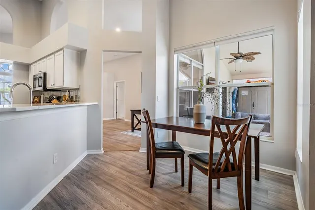 a dining room with furniture and window