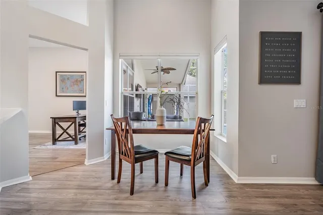 a dining room with furniture and window