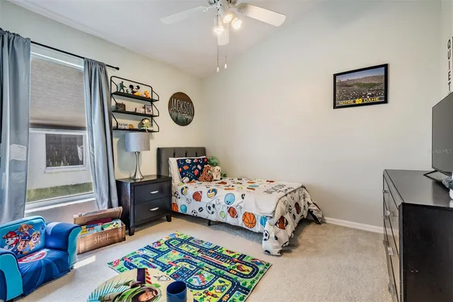 a bedroom with bed and a window