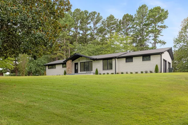a front of a house with a garden