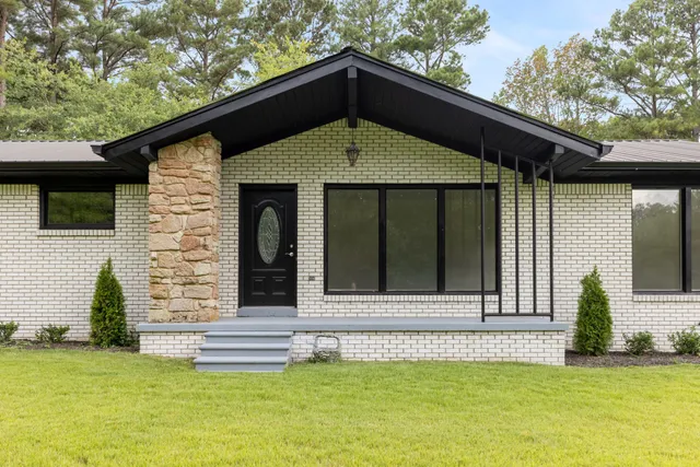 a view of an empty room and glass door