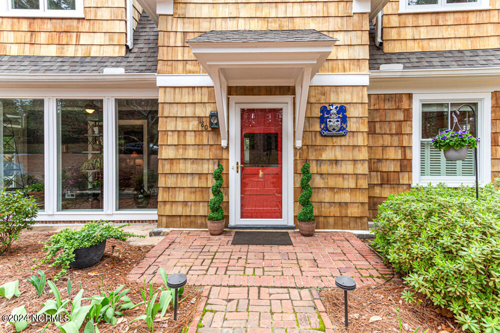 Treated cedar shingles and freshly painted exterior.