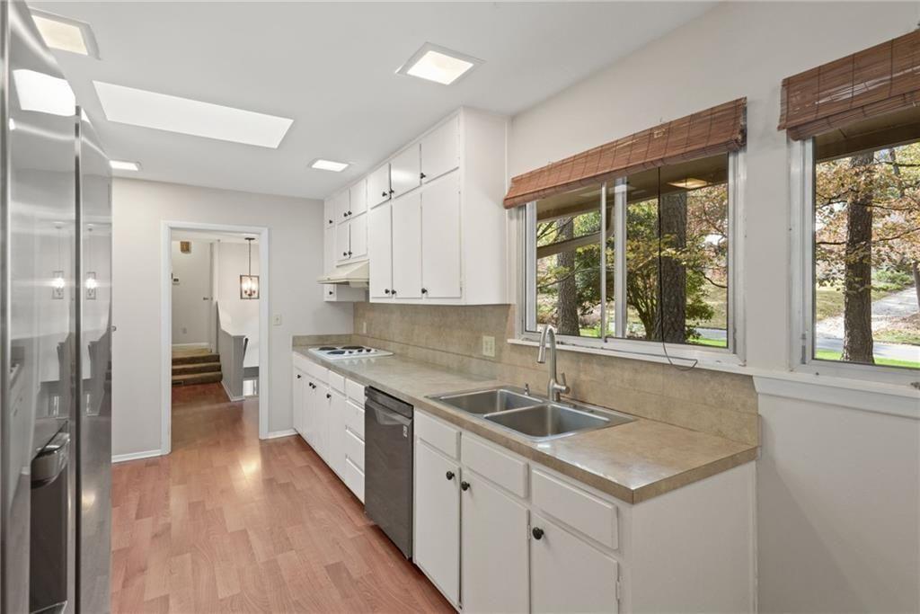 705 Edgewater Trail Sandy Springs, GA 30328 - Photo 16 of 36 a kitchen with a sink stove and refrigerator