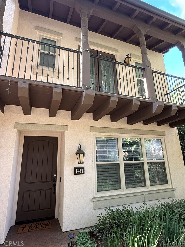 254 Kempton Irvine, CA 92620 - Photo 4 of 18 a front view of a house with a balcony
