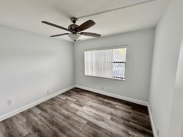 10006 Winding Lake Road, Unit 101 Sunrise, FL 33351 - Photo 12 of 14 an empty room with wooden floor fan and windows