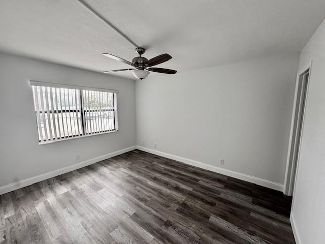 10006 Winding Lake Road, Unit 101 Sunrise, FL 33351 - Photo 5 of 14 wooden floor in an empty room with a window