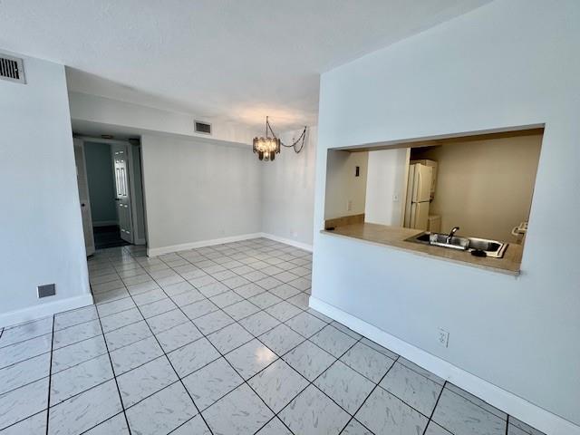 10006 Winding Lake Road, Unit 101 Sunrise, FL 33351 - Photo 8 of 14 a view of an empty room