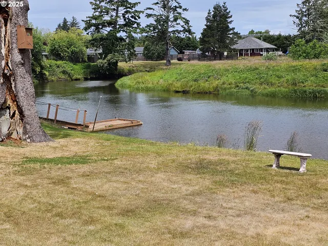 a view of a lake with houses in the back