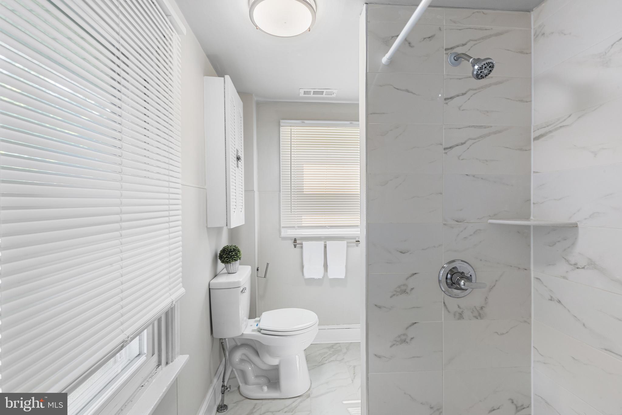 205 Callanan Avenue Bryn Mawr, PA 19010 - Photo 20 of 26 a bathroom with a toilet and a shower