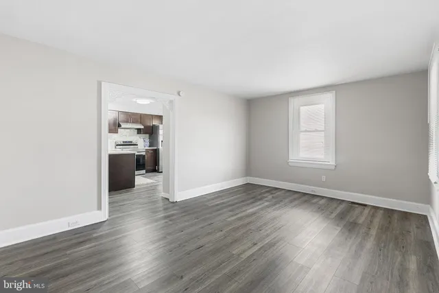 a kitchen with kitchen island a sink and a stove top oven