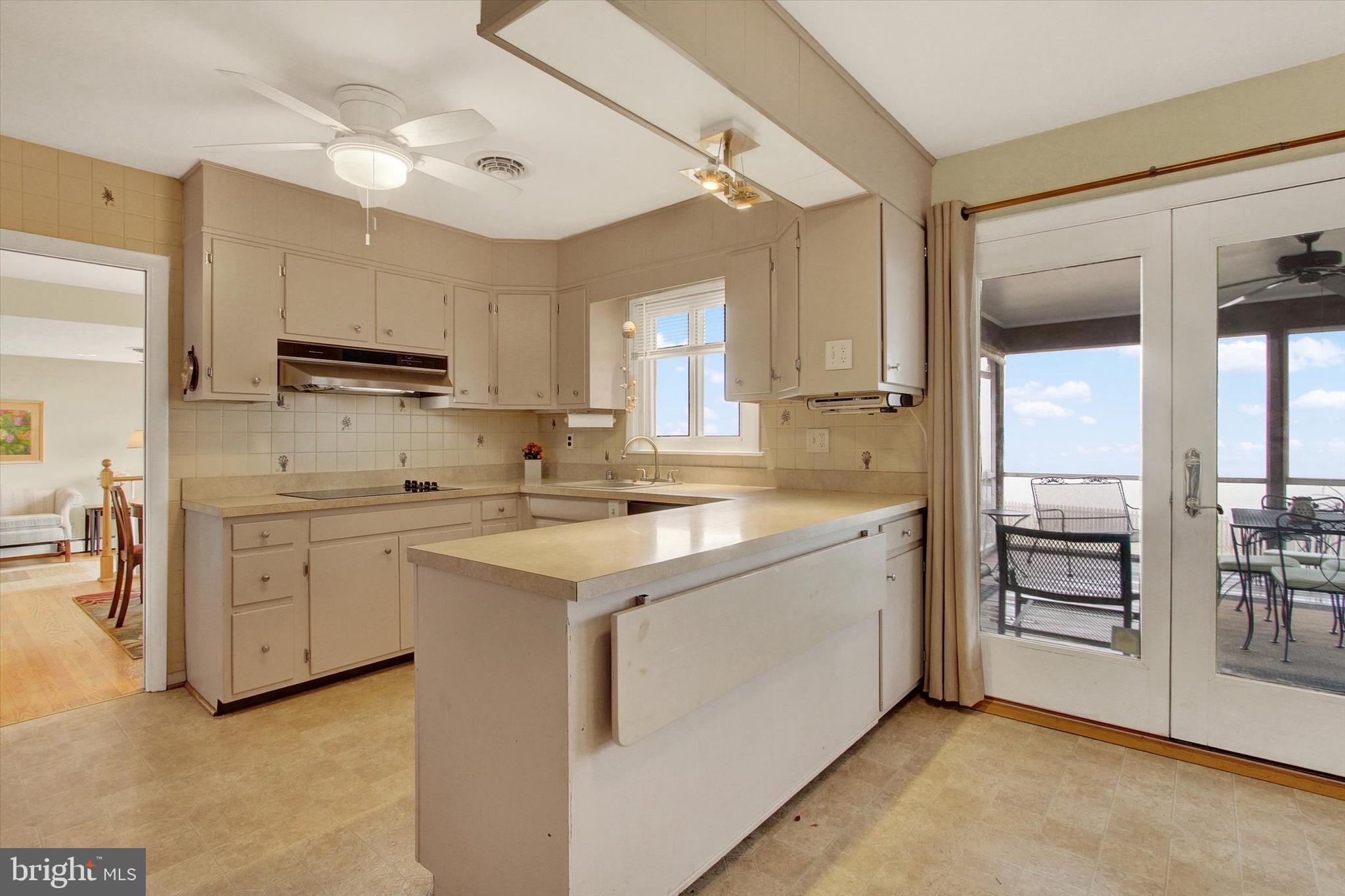 110 Lees Mill Road Hampstead, MD 21074 - Photo 13 of 39 a kitchen with cabinets appliances and a window
