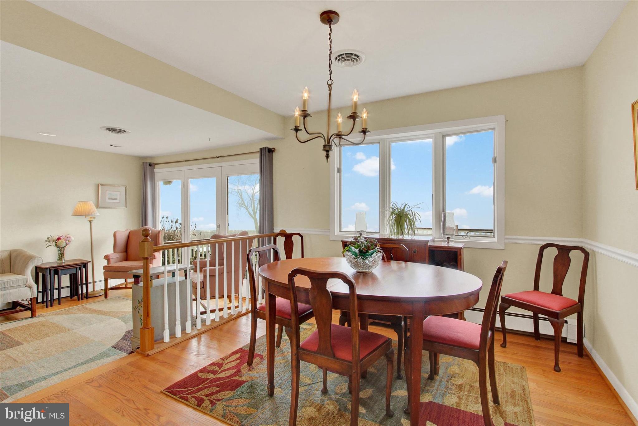 110 Lees Mill Road Hampstead, MD 21074 - Photo 21 of 39 a view of a a dining room with furniture window and wooden floor
