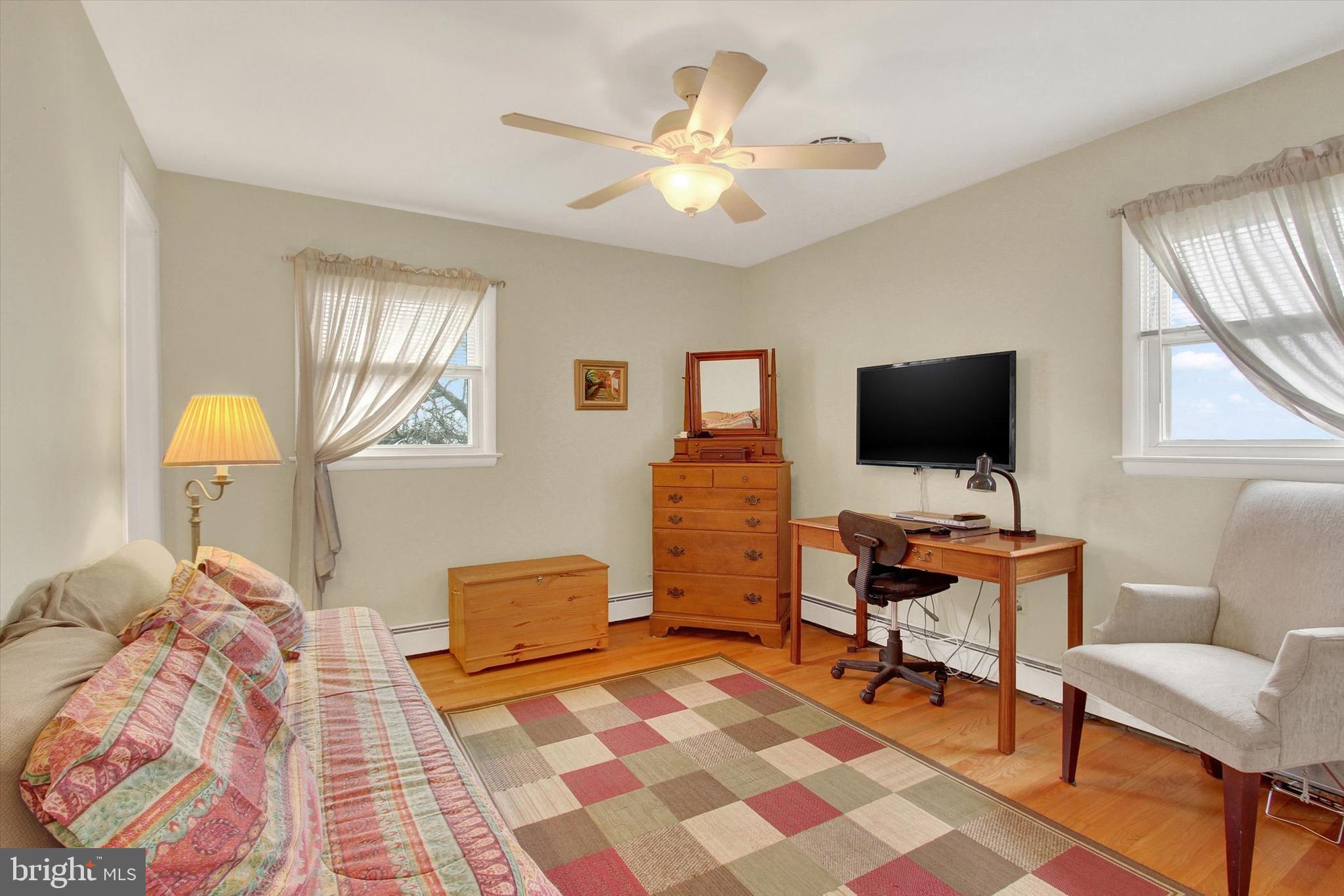 110 Lees Mill Road Hampstead, MD 21074 - Photo 23 of 39 a living room with furniture and a flat screen tv