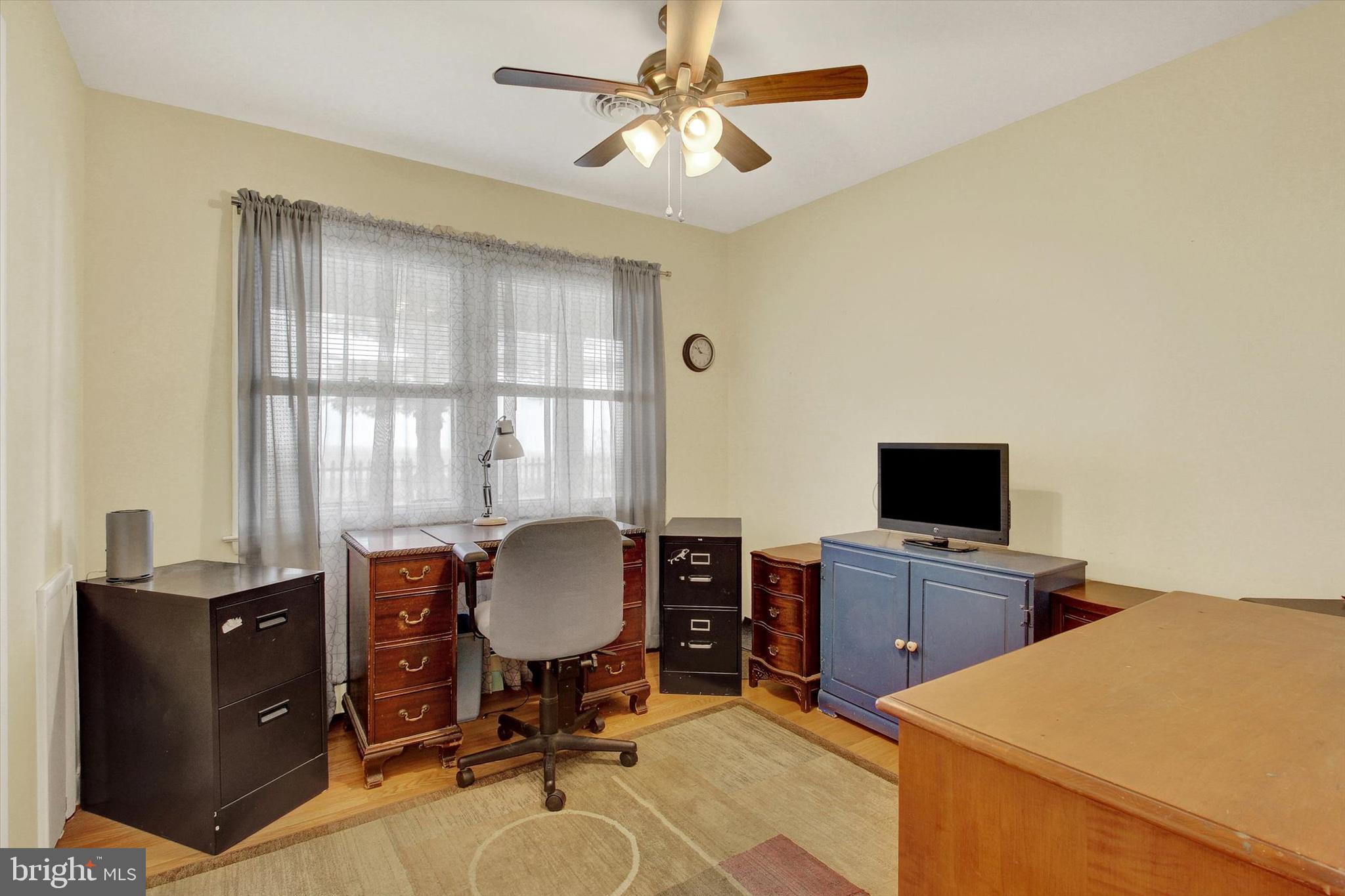 110 Lees Mill Road Hampstead, MD 21074 - Photo 24 of 39 a view of a workspace with furniture and a window