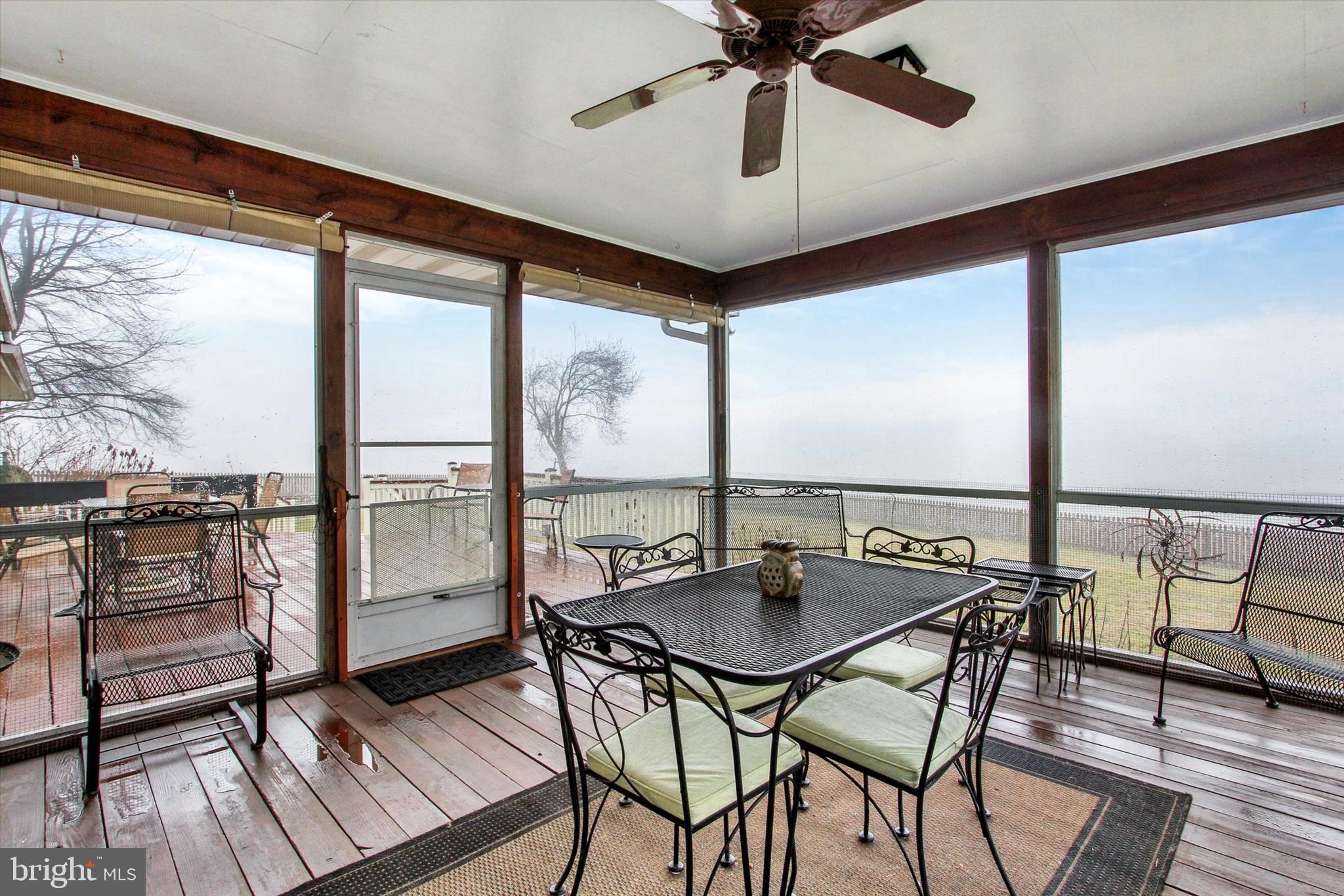 110 Lees Mill Road Hampstead, MD 21074 - Photo 33 of 39 a view of a dining room with furniture window and wooden floor