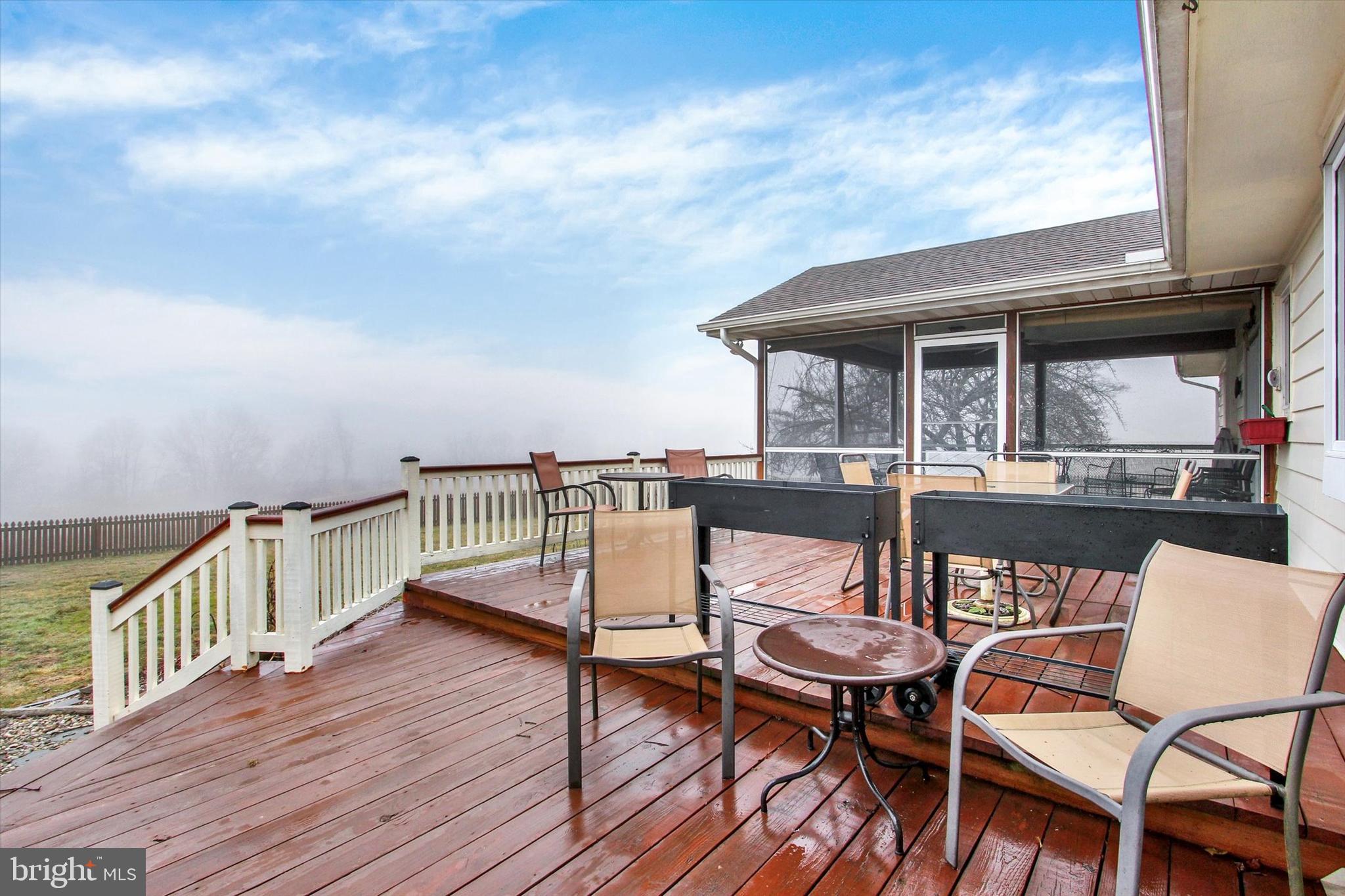 110 Lees Mill Road Hampstead, MD 21074 - Photo 35 of 39 a balcony with furniture and wooden floor