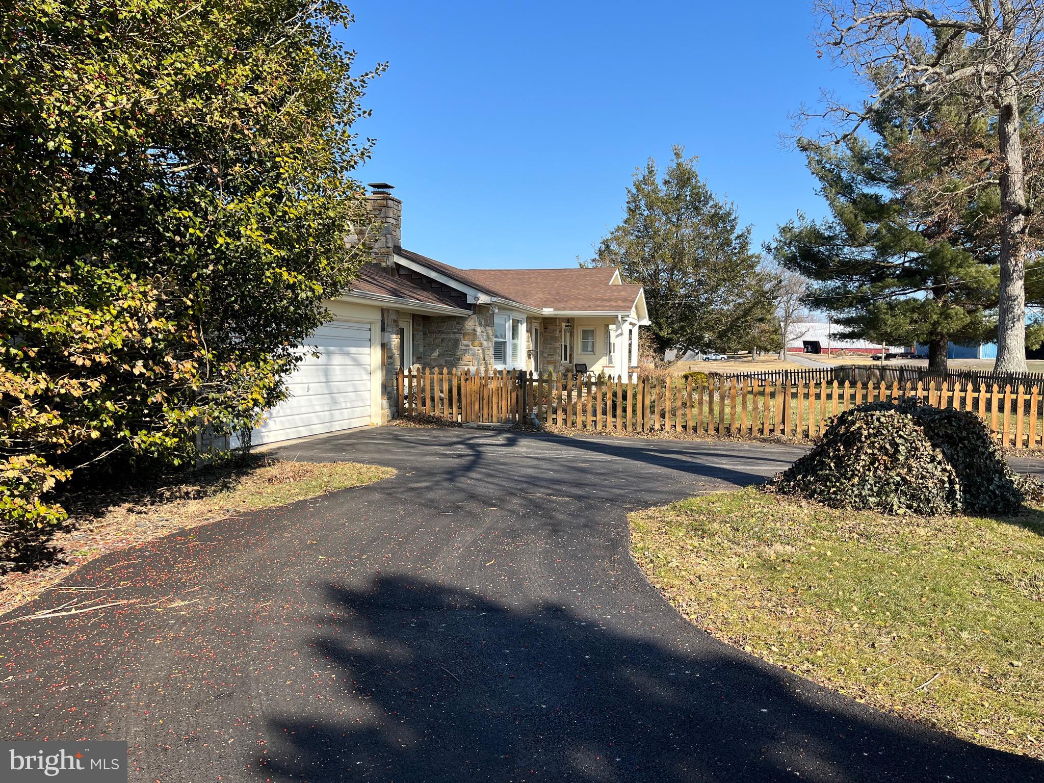 110 Lees Mill Road Hampstead, MD 21074 - Photo 39 of 39 a view of a house with large trees and wooden fence