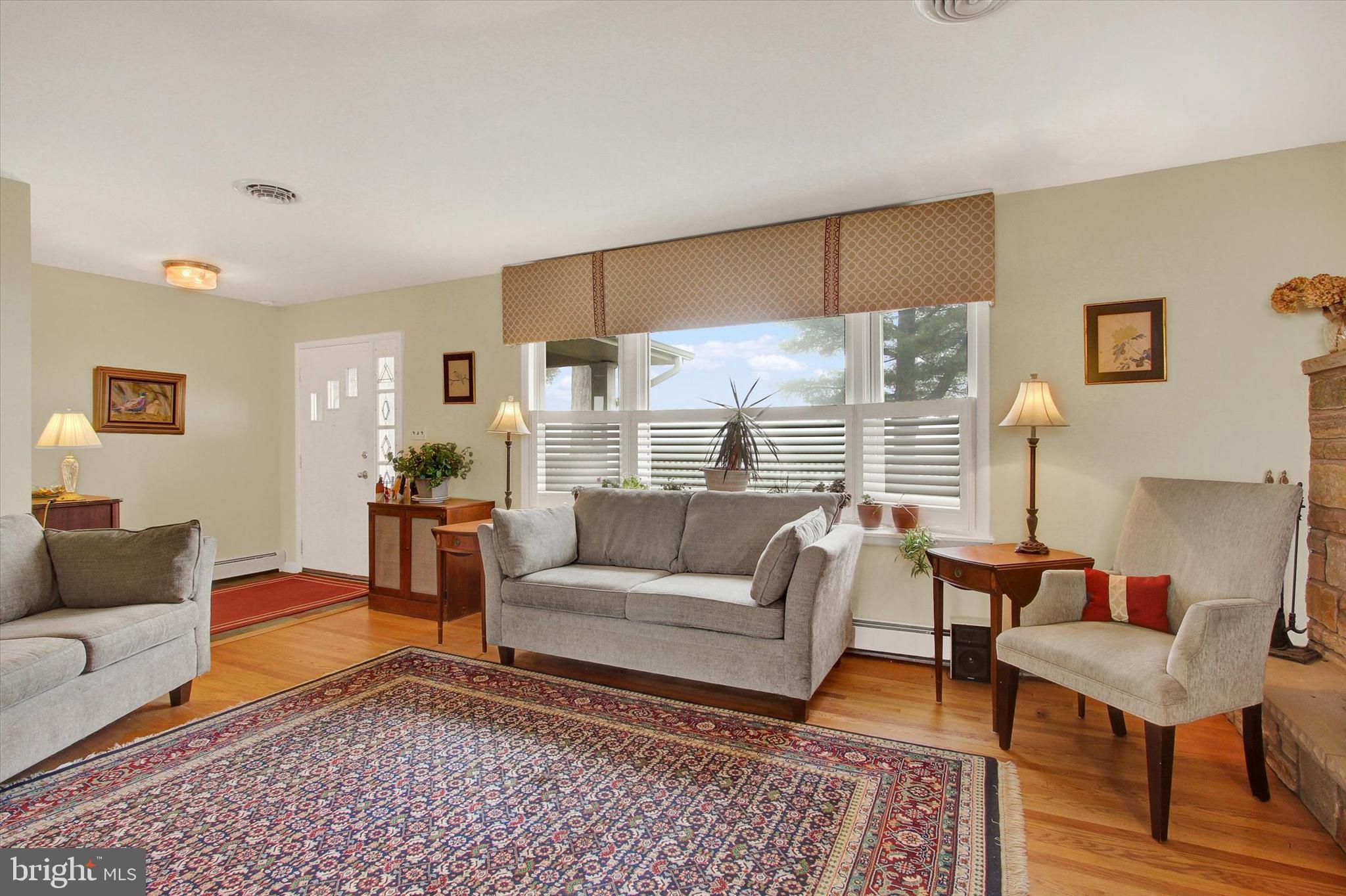 110 Lees Mill Road Hampstead, MD 21074 - Photo 6 of 39 a living room with furniture and a couch