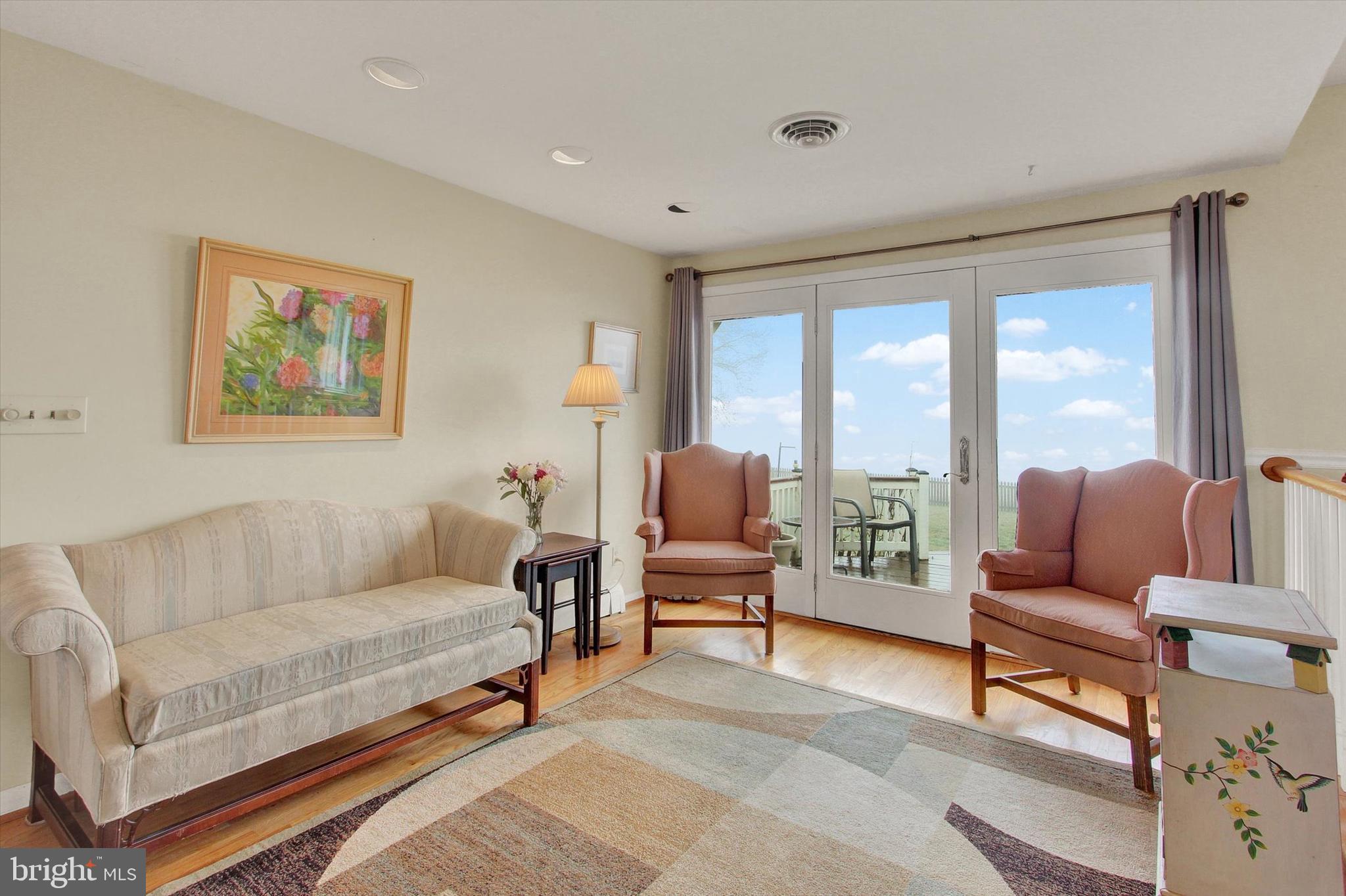 110 Lees Mill Road Hampstead, MD 21074 - Photo 8 of 39 a living room with furniture and a large window