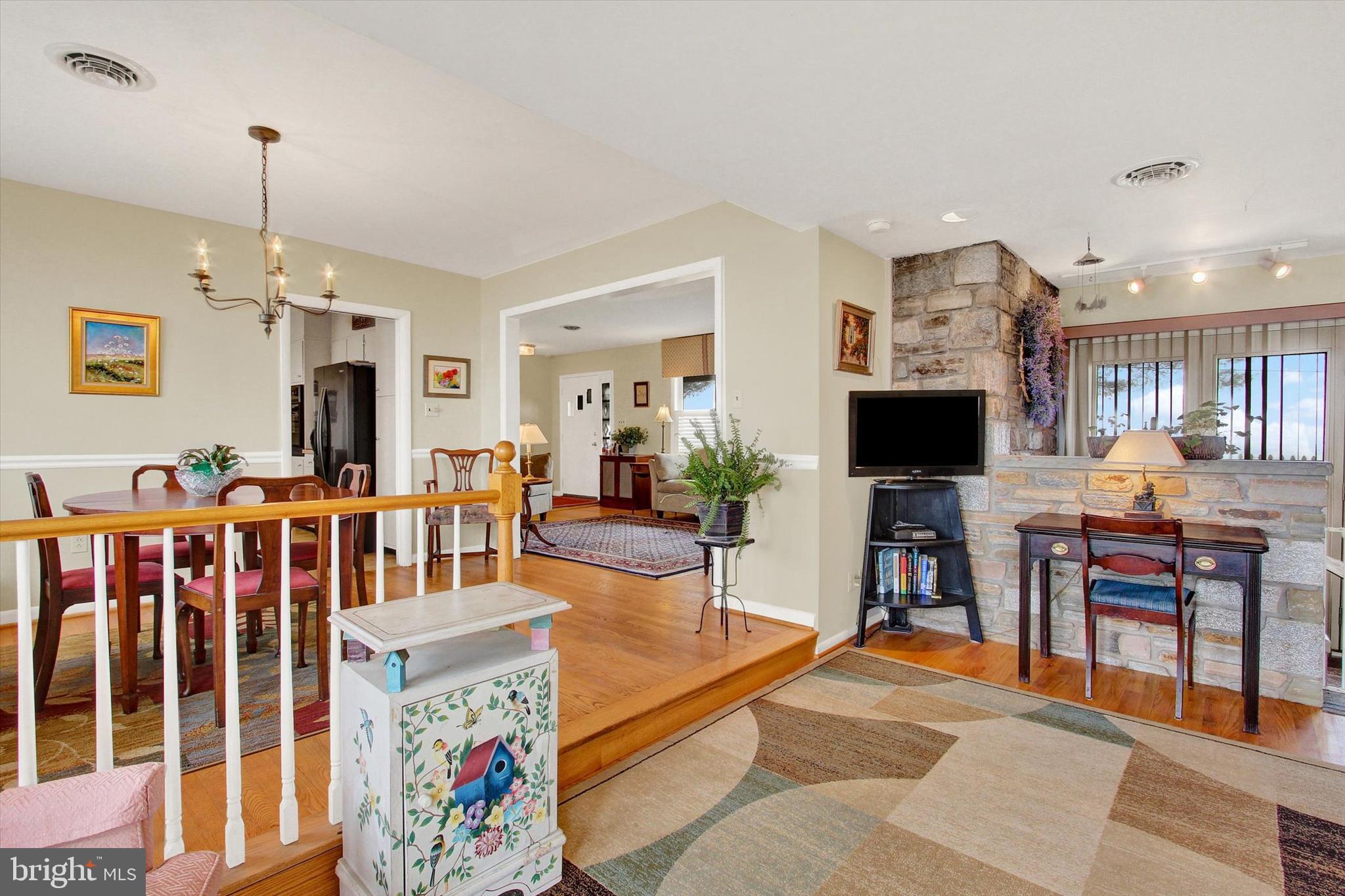 110 Lees Mill Road Hampstead, MD 21074 - Photo 10 of 39 a living room with furniture kitchen view and a flat screen tv