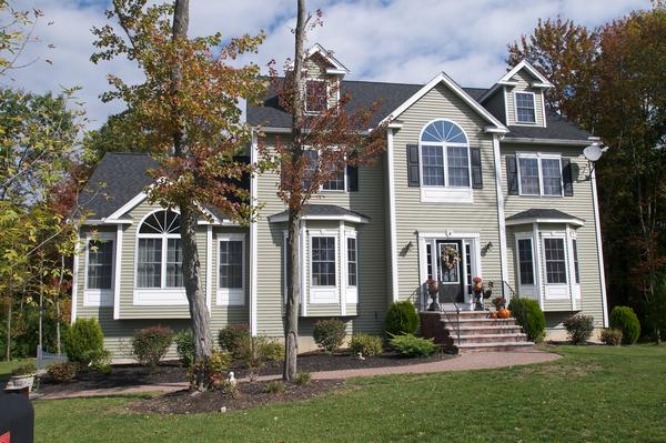 4 Devonshire Road Amesbury, MA 01913 - Photo 1 of 23 a front view of a house with a yard