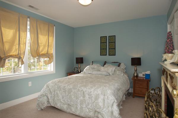 4 Devonshire Road Amesbury, MA 01913 - Photo 14 of 23 a bedroom with a bed flat screen tv and next to a window