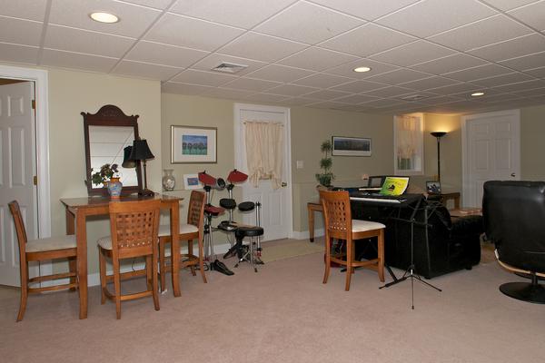 4 Devonshire Road Amesbury, MA 01913 - Photo 18 of 23 a view of a workspace with furniture and a livingroom