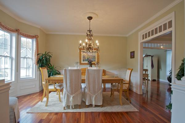 4 Devonshire Road Amesbury, MA 01913 - Photo 2 of 23 a dining room with furniture a chandelier and wooden floor