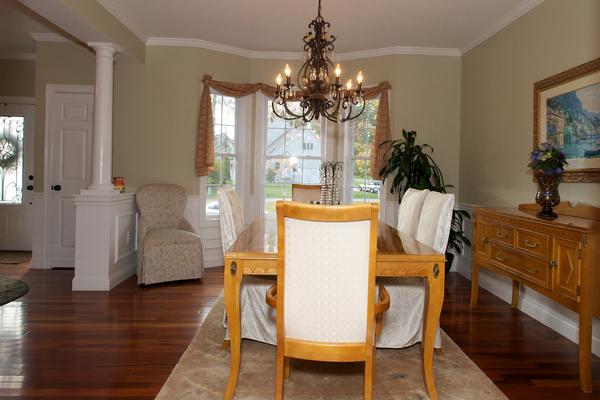 4 Devonshire Road Amesbury, MA 01913 - Photo 3 of 23 a dining room with furniture a chandelier and wooden floor