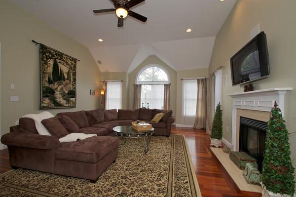 4 Devonshire Road Amesbury, MA 01913 - Photo 5 of 23 a living room with furniture a flat screen tv and a fireplace